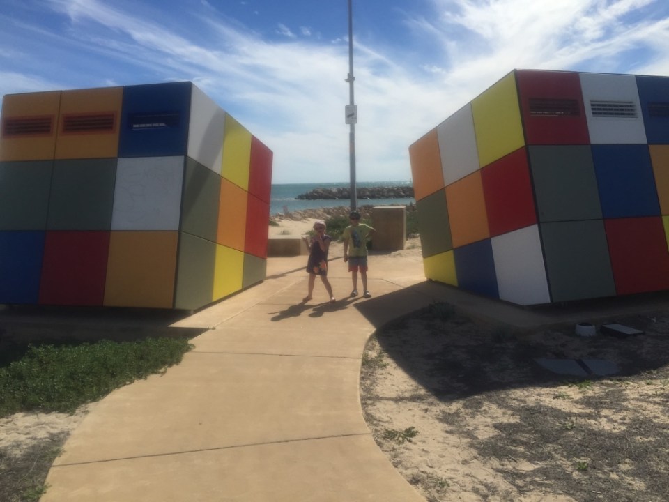 Kids with BIG Rubix Cube - these were actually cool public toilets on the water front. 