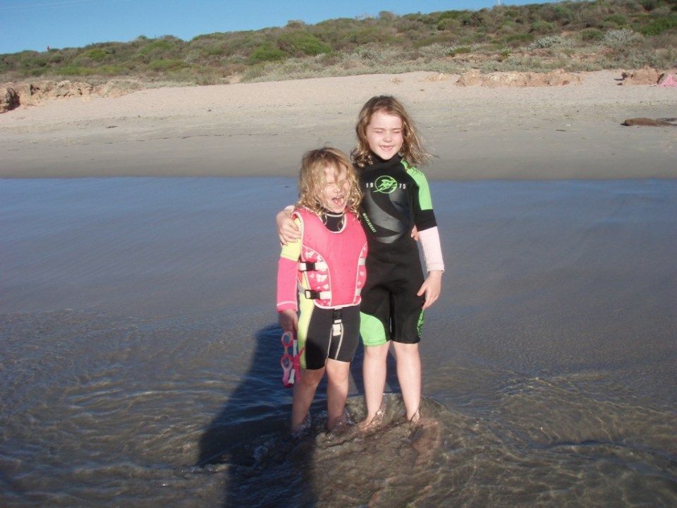 The girls jumping waves