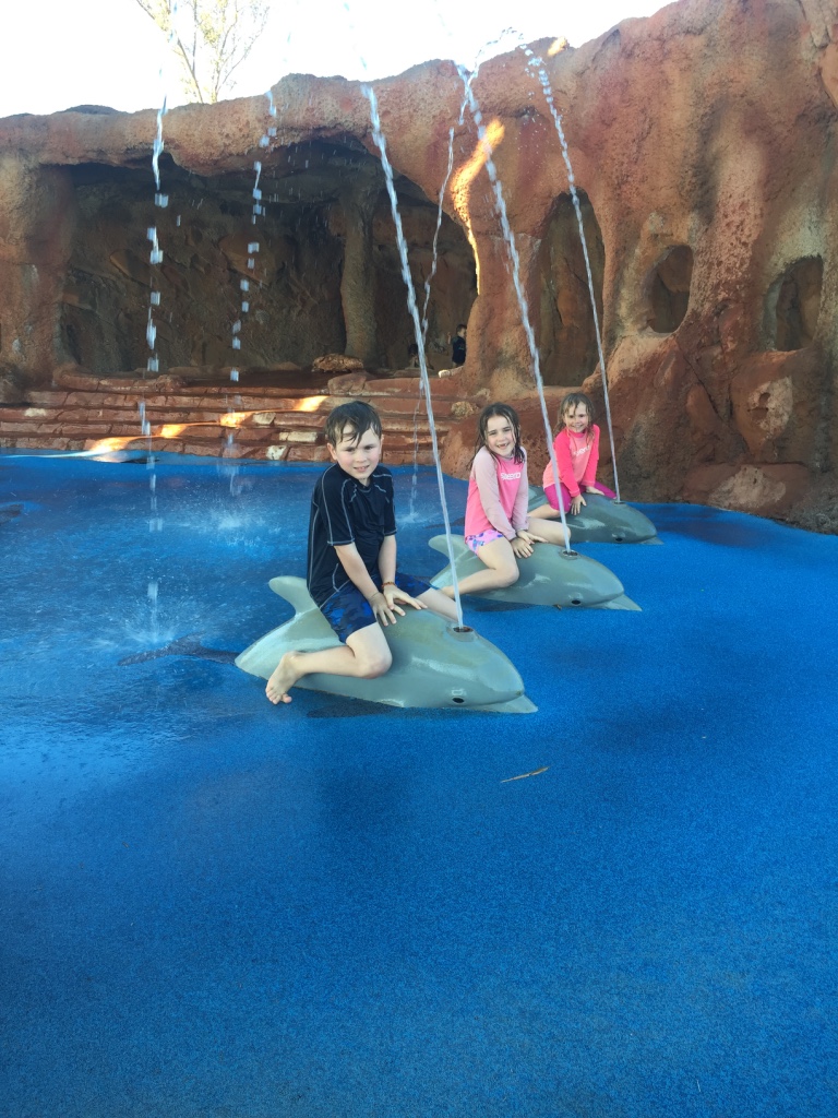 Exmouth water park riding the dolphins