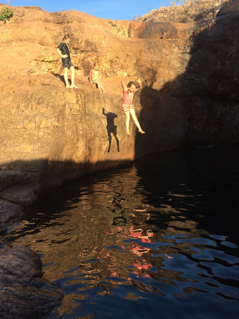 Jumping into Surprise Creek rock holes